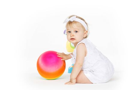 beautiful little girl all in white clothesの写真素材
