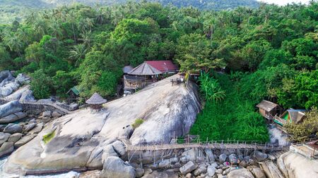 beautiful landscape with a huge stone and palm treesの写真素材