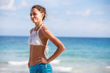 portrait of a beautiful girl in a white swimsuitの写真素材