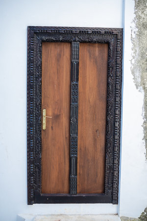 Antique old wooden door. Beautiful colour. Bright sunny day.の写真素材