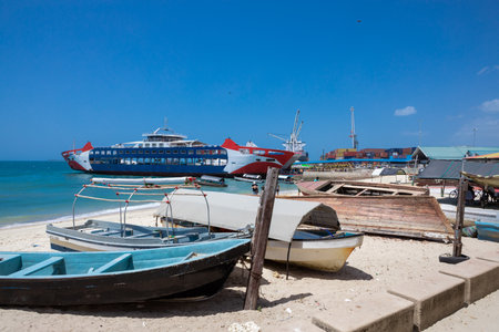 Vintage boats lying on the snow-white beach of the island of Zanzibar.の写真素材