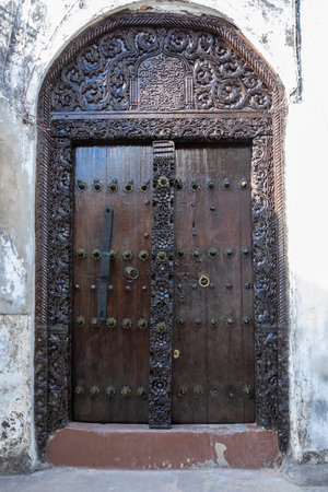 Antique old wooden door. Beautiful colour. Bright sunny day.の写真素材