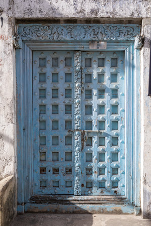 Antique old wooden door. Beautiful colour. Bright sunny day.の写真素材
