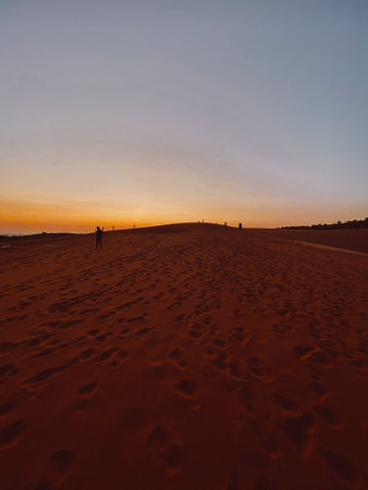 Red sand dunes on sunset near Mui Ne or Phan Thiet city in Vietnam Asiaの写真素材