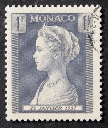 MONACO - CIRCA 1957. Vintage stamp printed in Monaco shows image portrait of famous American actress Grace Kelly (1929-1982) who married Rainier III Prince of Monaco.の写真素材