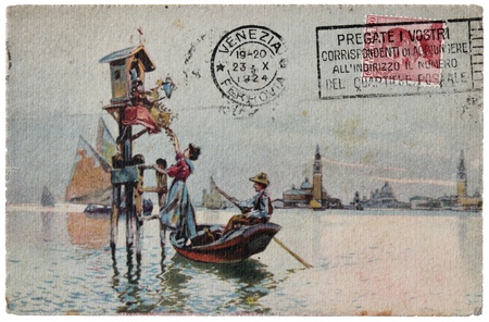 ITALY - CIRCA 1924: a stamp printed by ITALY shows portrait of King Victor Emmanuel III. Stamp is on the old  postcard shows view of Venice, circa 1924. の写真素材