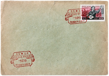 RUSSIA - CIRCA 1959: a stamp printed by Soviet Union shows Russian woman letter-carrier. Text in the stamp and postmark means: の写真素材