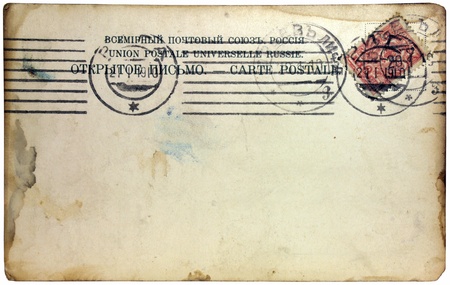 RUSSIA - CIRCA 1910: a stamps printed by Russia shows Double Eagle - National  Emblem of Russia. The stamp is on the postcard which partially burned on the edges, circa 1910.のeditorial素材