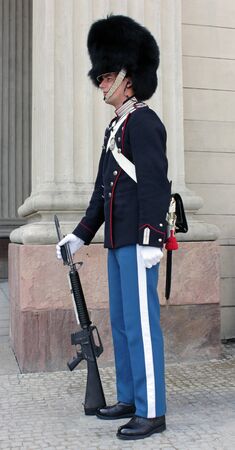 DENMARK, COPENHAGEN - MAY 15: A Danish soldier guarding  Amalienborg Palace at May 15, 2012. This palace is the Danish Royal residence and a top tourist attraction as well.のeditorial素材