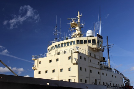  Icebreaker moored at the berth of a Baltic sea port in sunny day against deep blue sky.のeditorial素材