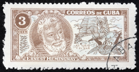 CUBA - CIRCA 1963: A stamp printed by CUBA shows image portrait of Nobel Prize-winner for Literature famous American writer Ernest Hemingway (1899-1961), "The Old Man and The Sea", circa 1963のeditorial素材