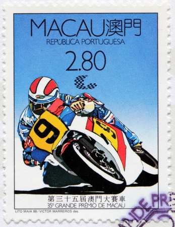 MACAU - CIRCA 1988: a stamp printed by PORTUGAL shows motorcycle competition in Macau, circa 1988.のeditorial素材
