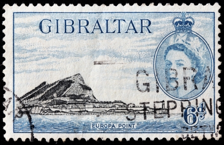 GIBRALTAR - CIRCA 1953: A stamp printed by GIBRALTAR shows image portrait of Queen Elizabeth II and view of Gibraltar, circa 1953.のeditorial素材