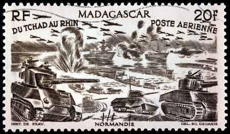 MADAGASCAR - CIRCA 1946: A postage stamp printed by MADAGASCAR shows Allied invasion of Normandy on Tuesday, 6 June 1944 (D-Day), circa 1946のeditorial素材