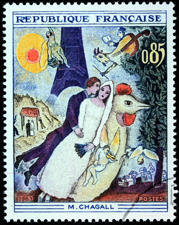 FRANCE - CIRCA 1963: A stamp printed by FRANCE shows engraving after painting Married couple at the Eiffel Tower by Belarussian-Russian-French artist Marc Chagall (1887-1995), circa 1963のeditorial素材