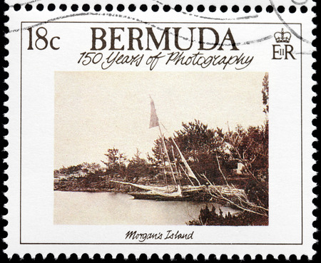 BERMUDA - CIRCA 1989: A stamp printed by GREAT BRITAIN shows old photograph of Morgan's Island. Morgan's Island is an island of Bermuda, circa 1989のeditorial素材