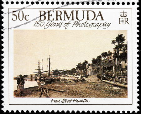 BERMUDA - CIRCA 1989: A stamp printed by GREAT BRITAIN shows old photograph of Front Street in Hamilton. Hamilton is capital city of the Bermudas, circa 1989のeditorial素材