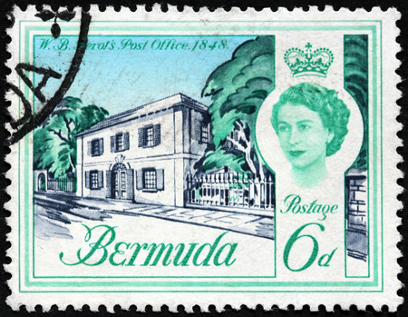 BERMUDA - CIRCA 1962: A stamp printed by BERMUDAS ISLES shows view of Bermuda's first Postmaster General William Bennet Perot Post Office (1848), circa 1962のeditorial素材