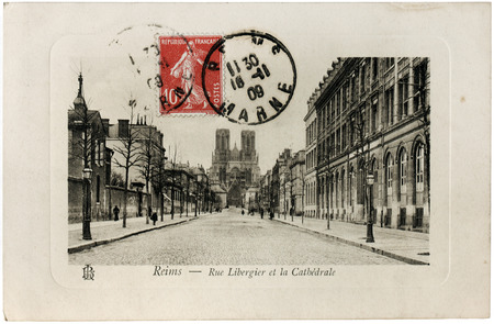 Ancient postcard printed in France at 1909 shows view of Libergier Street and Cathedral of Notre-Dame de Reims. Reims is a city in the Champagne-Ardenne region of France.のeditorial素材