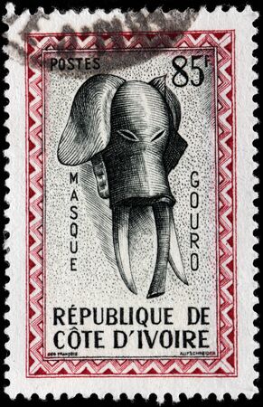 IVORY COAST - CIRCA 1960: A stamp printed by IVORY COAST shows African Elephant Mask, circa 1960のeditorial素材