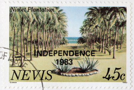 NEVIS - CIRCA 1983: A stamp printed by NEVIS shows beautiful view of Nisbet Plantation, circa 1983のeditorial素材
