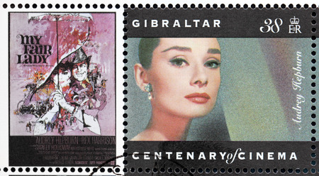 GIBRALTAR - CIRCA 1995. A postage stamp printed by GIBRALTAR shows image portrait of British and American actress Audrey Hepburn, recognized as both a film and fashion icon, circa 1995.のeditorial素材
