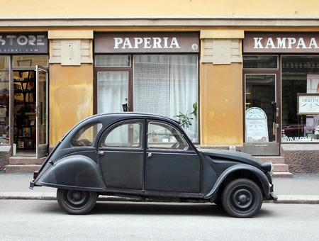 HELSINKI, FINLAND - MAY 28, 2016: Side view of old small dusty car at the famous Design District on Pursimiehenkatu street in Helsinki, Finland,  May 28, 2016.のeditorial素材