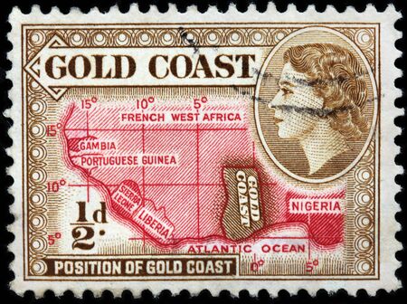 LUGA, RUSSIA - JUNE 25, 2016: A stamp printed by GOLD COAST shows image portrait of Queen Elizabeth II against position of Gold Coast on Africa map, circa 1953のeditorial素材
