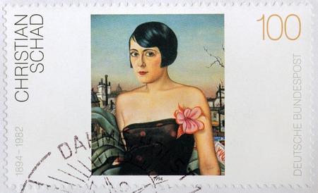 LUGA, RUSSIA - DECEMBER 2, 2013: A stamp printed by GERMANY shows picture Maika by famous German painter Christian Schad, circa 1994.のeditorial素材