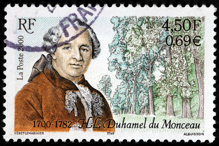 LUGA, RUSSIA - SEPTEMBER 18, 2015: A stamp printed by FRANCE shows image portrait of Henri-Louis Duhamel du Monceau - a French physician, naval engineer and botanist, circa 2000のeditorial素材