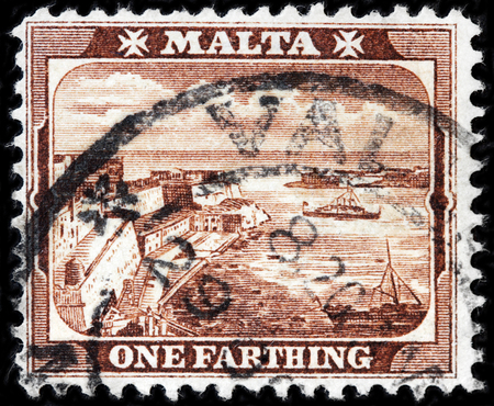 LUGA, RUSSIA - APRIL 26, 2017: A stamp printed by MALTA shows view of Grand Harbor, Valetta, circa 1910のeditorial素材