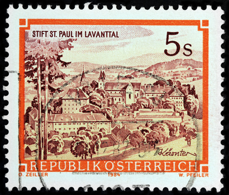 LUGA, RUSSIA - APRIL 26, 2017: A stamp printed by AUSTRIA shows beautiful view of Saint Paul Abbey in Lavanttal -  a Benedictine monastery established in 1091, circa1984のeditorial素材