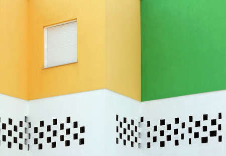 Abstract view of facade of Mediterranean house painted in traditional colors with copyspace.の写真素材