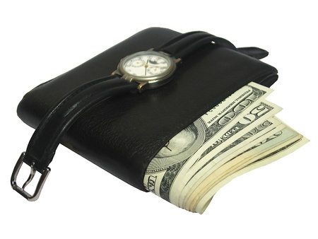 Wallet full with money and a watch over
