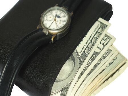 Wallet full with money and a watch over close upの写真素材