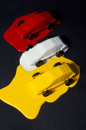 Small copies of sports automobiles filled with a paintの写真素材