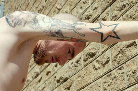 The young guy who is were fond tattooの写真素材