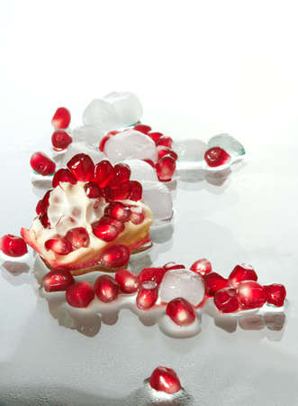 Berries of the broken pomegranate on glassの写真素材
