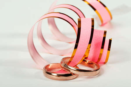Two wedding ring on a white background.の写真素材