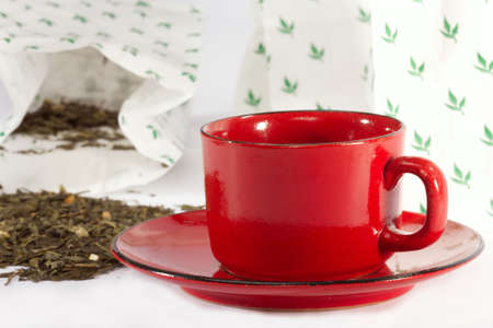 Leaves of green tea from packages of retail tradeの写真素材