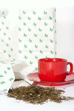 Leaves of green tea from packages of retail tradeの写真素材