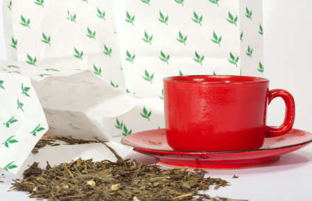 Leaves of green tea from packages of retail tradeの写真素材