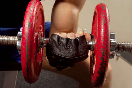 Man makes exercises for increase in force of musclesの写真素材