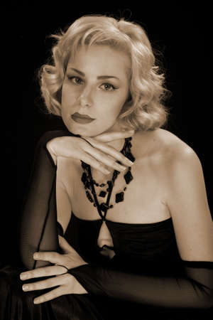 Blonde in a black dress in style of the beginning of 20 centuries