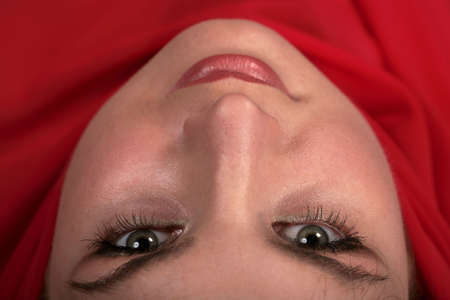 Portrait of east woman in a red scarfの写真素材