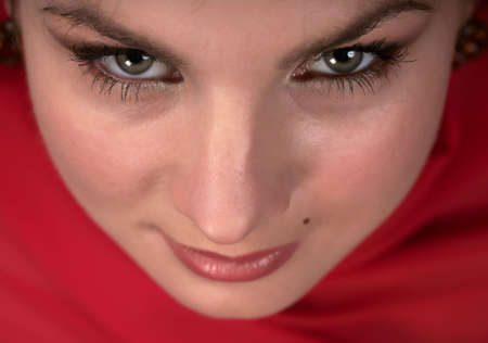 Portrait of east woman in a red scarfの写真素材