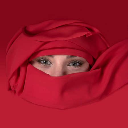 Portrait of east woman in a red scarfの写真素材