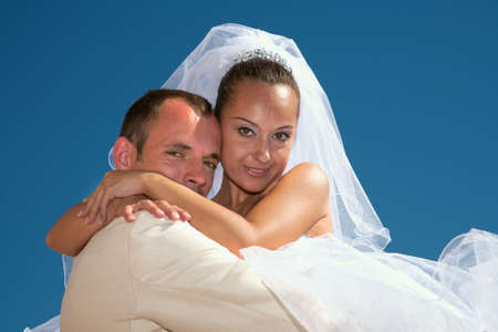 Happy family. A portrait on a background of the blue sky.の写真素材