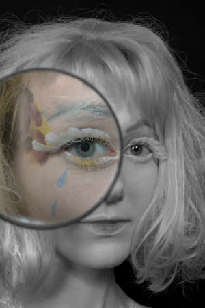 Girl with light hair in a make-up of an angel