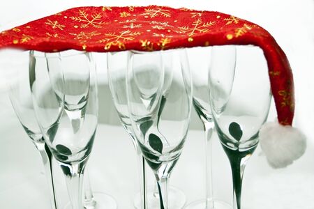 New Year's cap with glasses for champagne on a white backgroundの写真素材
